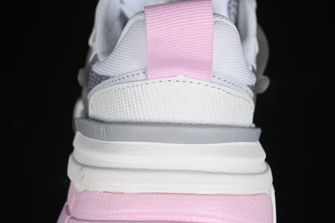 Rear view highlighting the pink heel pull tab and layered sole.