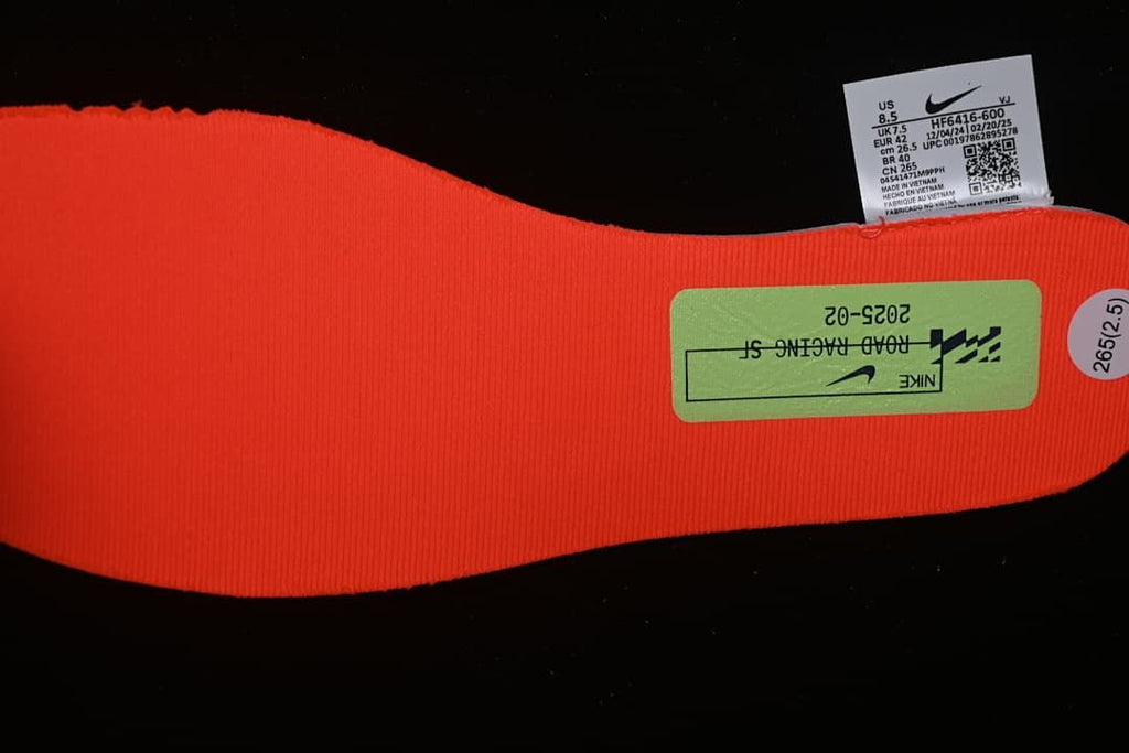 Shoe size label and coral-red insole, with EU 42 visible on the label.
