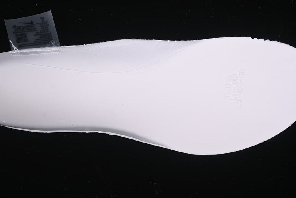 Close view of the underside of a white shoe sole