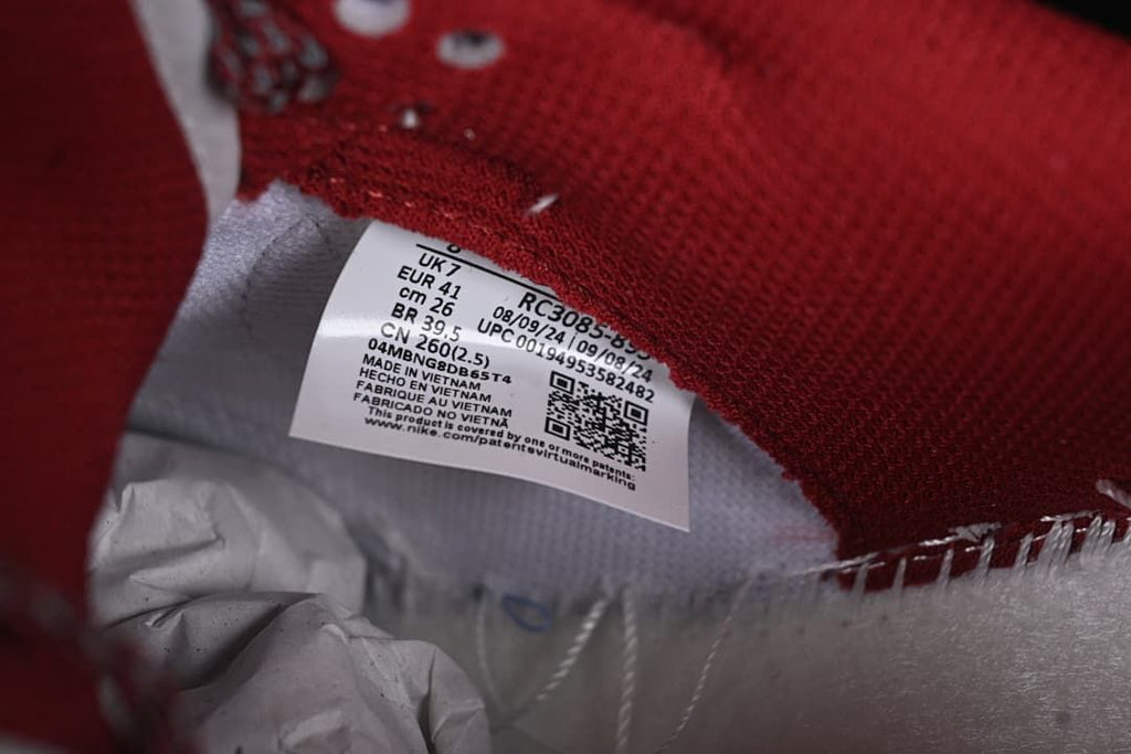 Close-up of the shoe's inner size label and burgundy lining