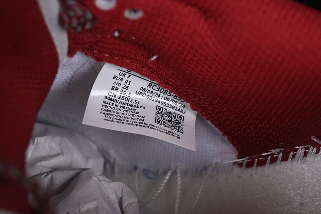 Close-up of the shoe's inner size label and burgundy lining