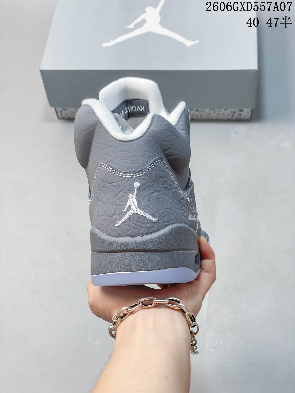 Rear view of the gray high-top sneaker with Jumpman heel logo