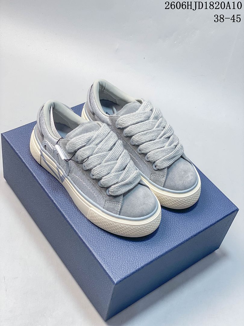 Pair of gray Dior B33 low-top sneakers with wide laces and off-white soles