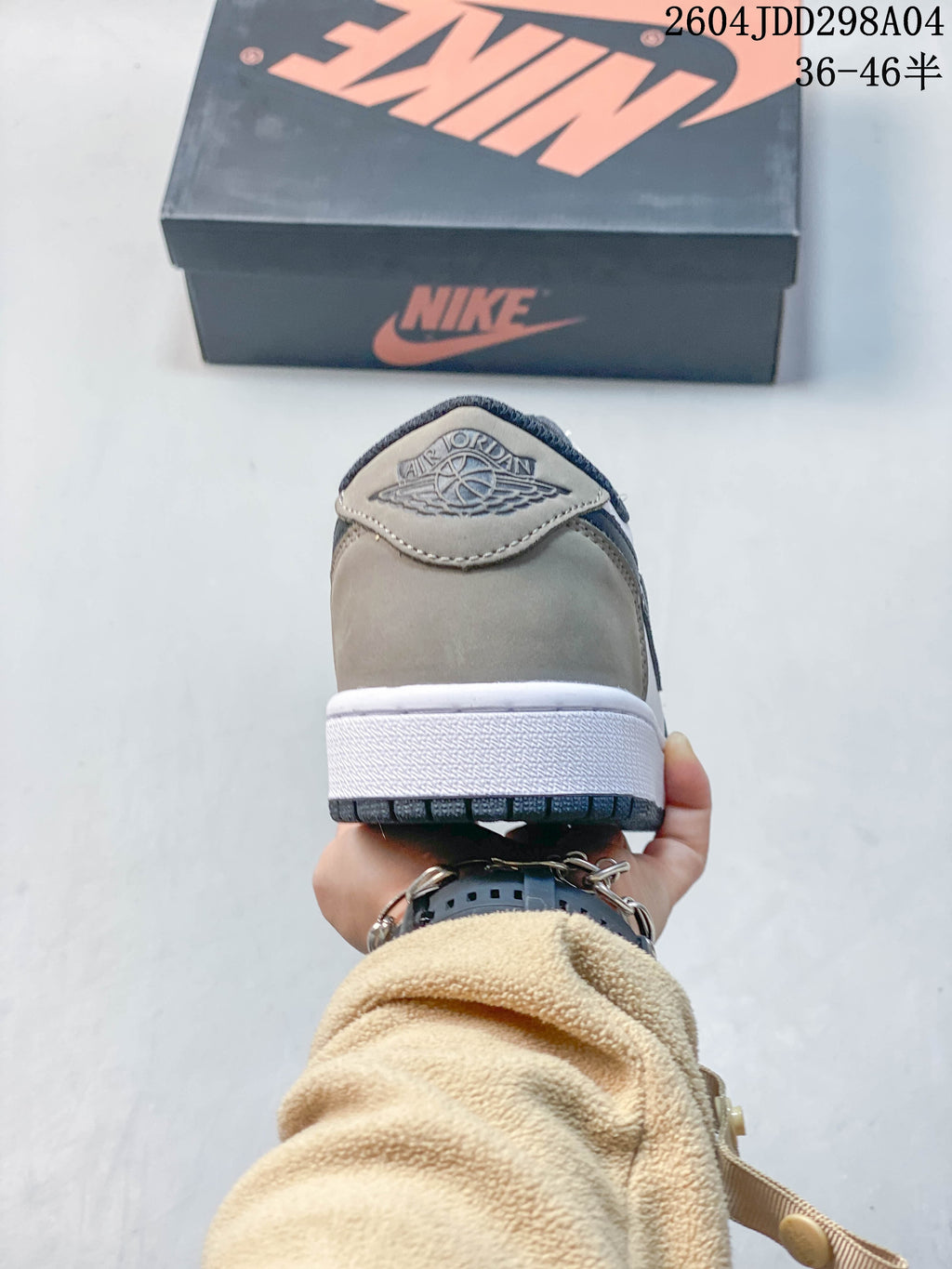 Rear view showing the grey heel panel and embossed Jordan Wings logo