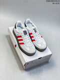 White and red Gazelle 90 sneakers with Hello Kitty details, shown on a box