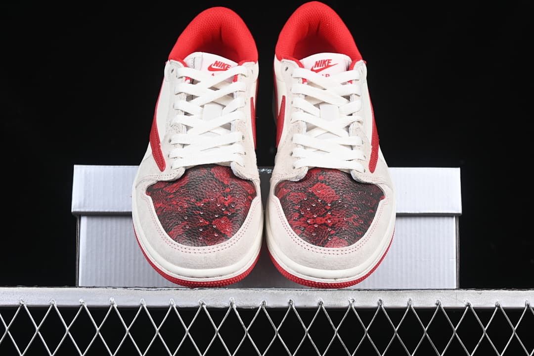 Front view of the pair showing patterned toe panels, white laces, and red collars.