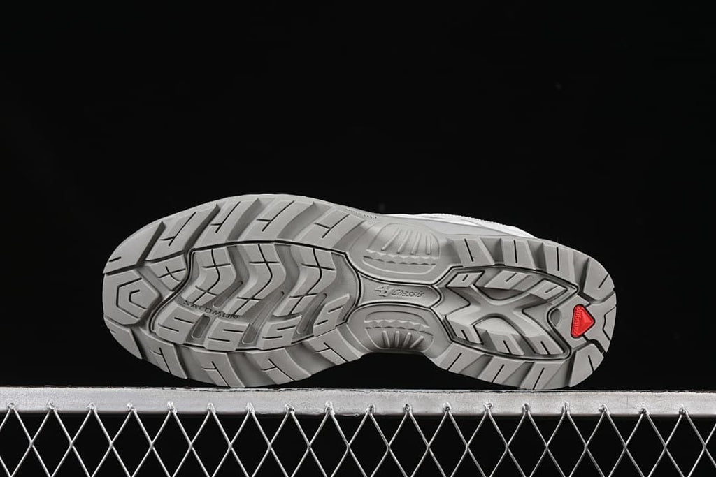 Underside view of the gray treaded outsole