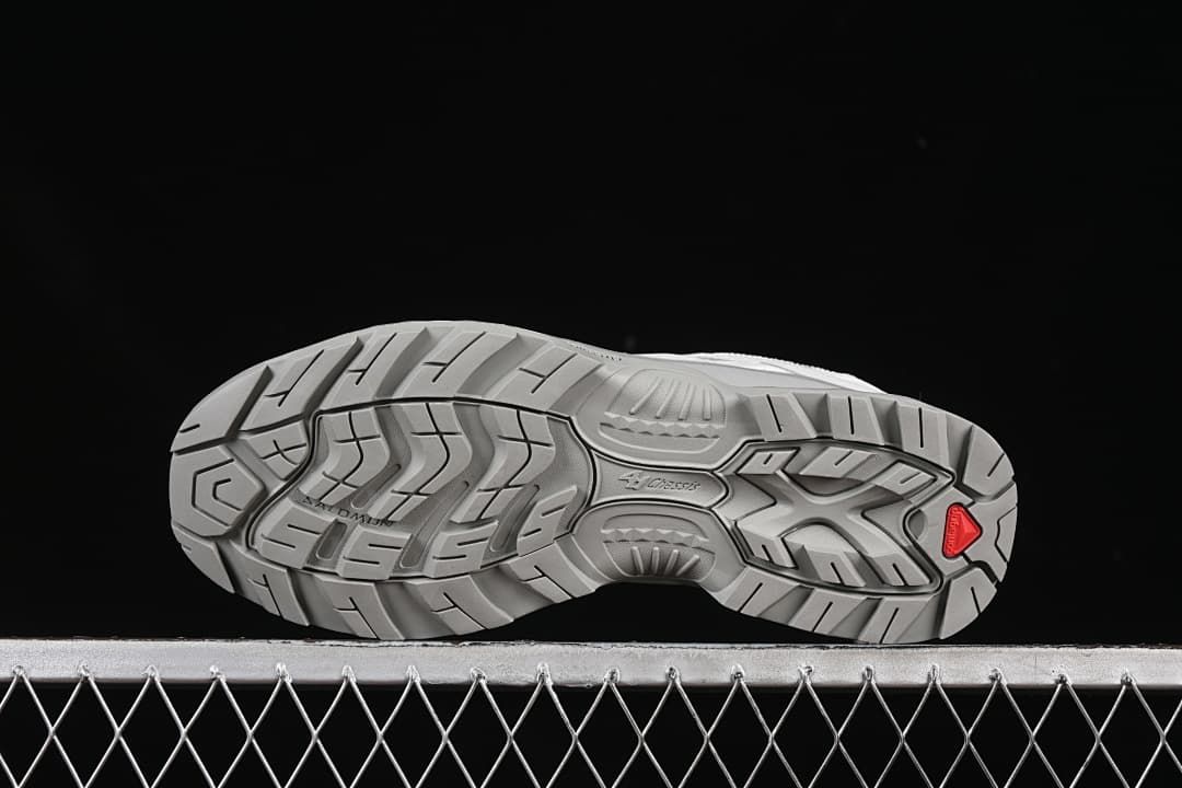 Underside view of the gray treaded outsole