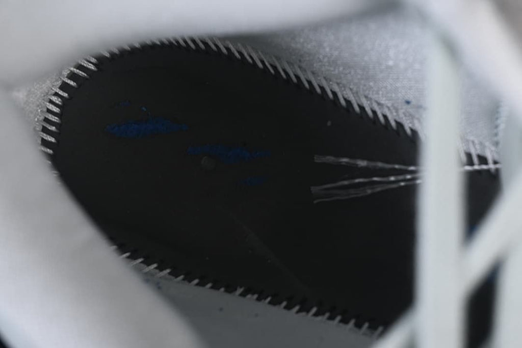 Close-up inside the shoe showing dark lining and stitching
