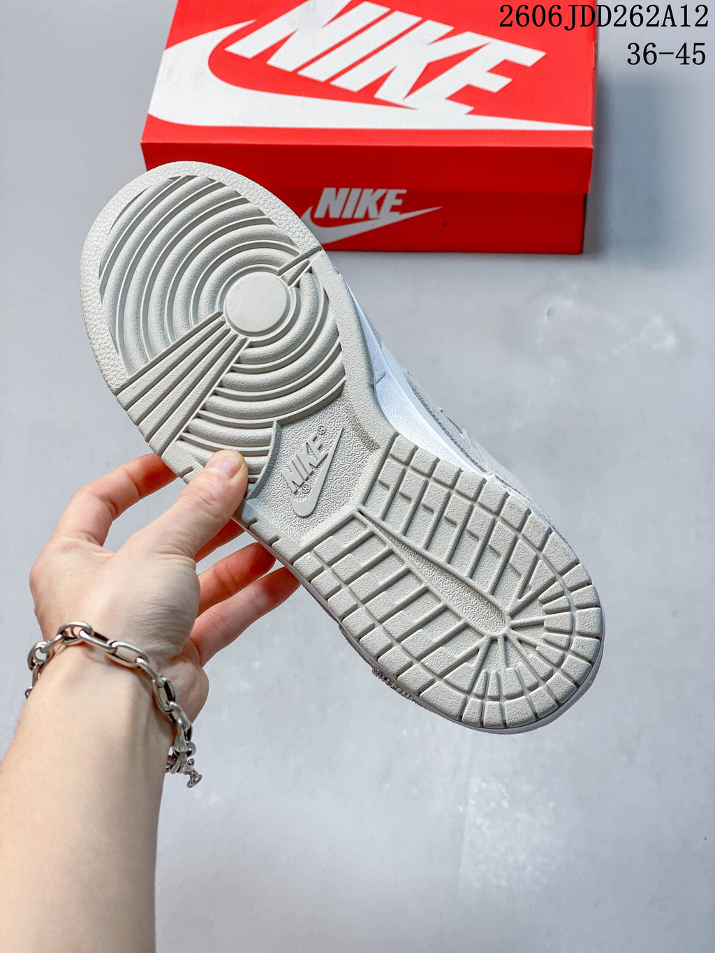 Close-up of the grey outsole with circular tread pattern.