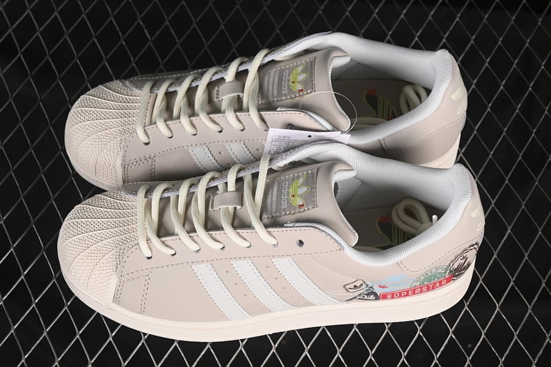 Pair of beige and white Superstar II sneakers shown from above.