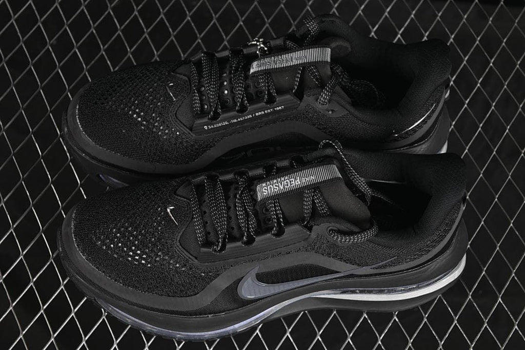 Pair of black running shoes shown from above at an angle.