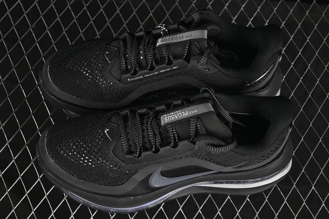 Pair of black running shoes shown from above at an angle.