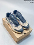 Pair of navy and beige SREGIEK Norvan 2556 GTX outdoor sneakers on a box; image text shows sizes 39–45.
