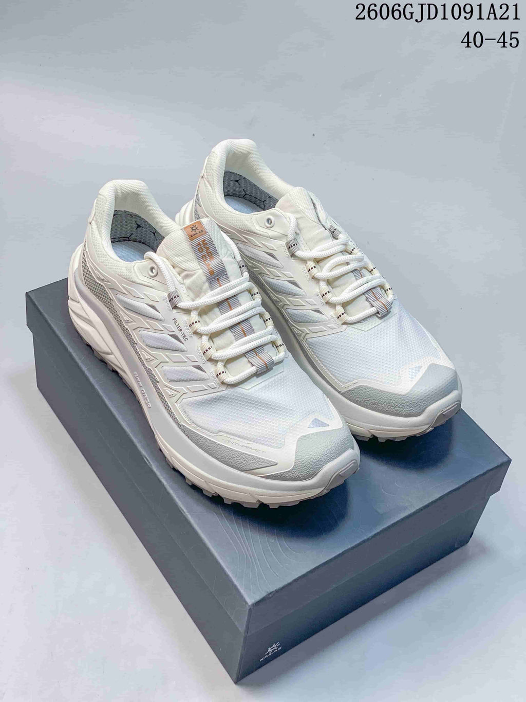 Three KAILAS trail shoes shown from the side in blue-gray and white colorways.