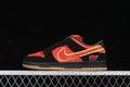 Side profile of a red-orange and black Nike SB Dunk Low with green lining, yellow-edged red Swoosh, Ghost Rider heel graphic, and gum outsole.