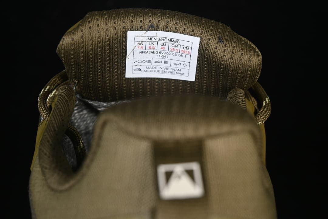 Tongue label showing a sample men's size and manufacturing information