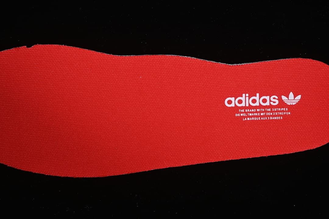 Red insole with adidas branding