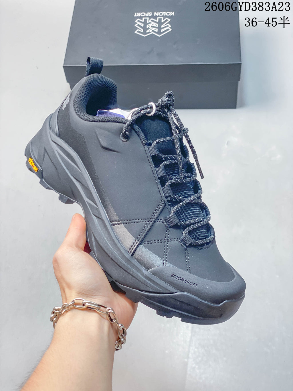 Three-quarter view of a dark gray Kolon Sport hiking sneaker