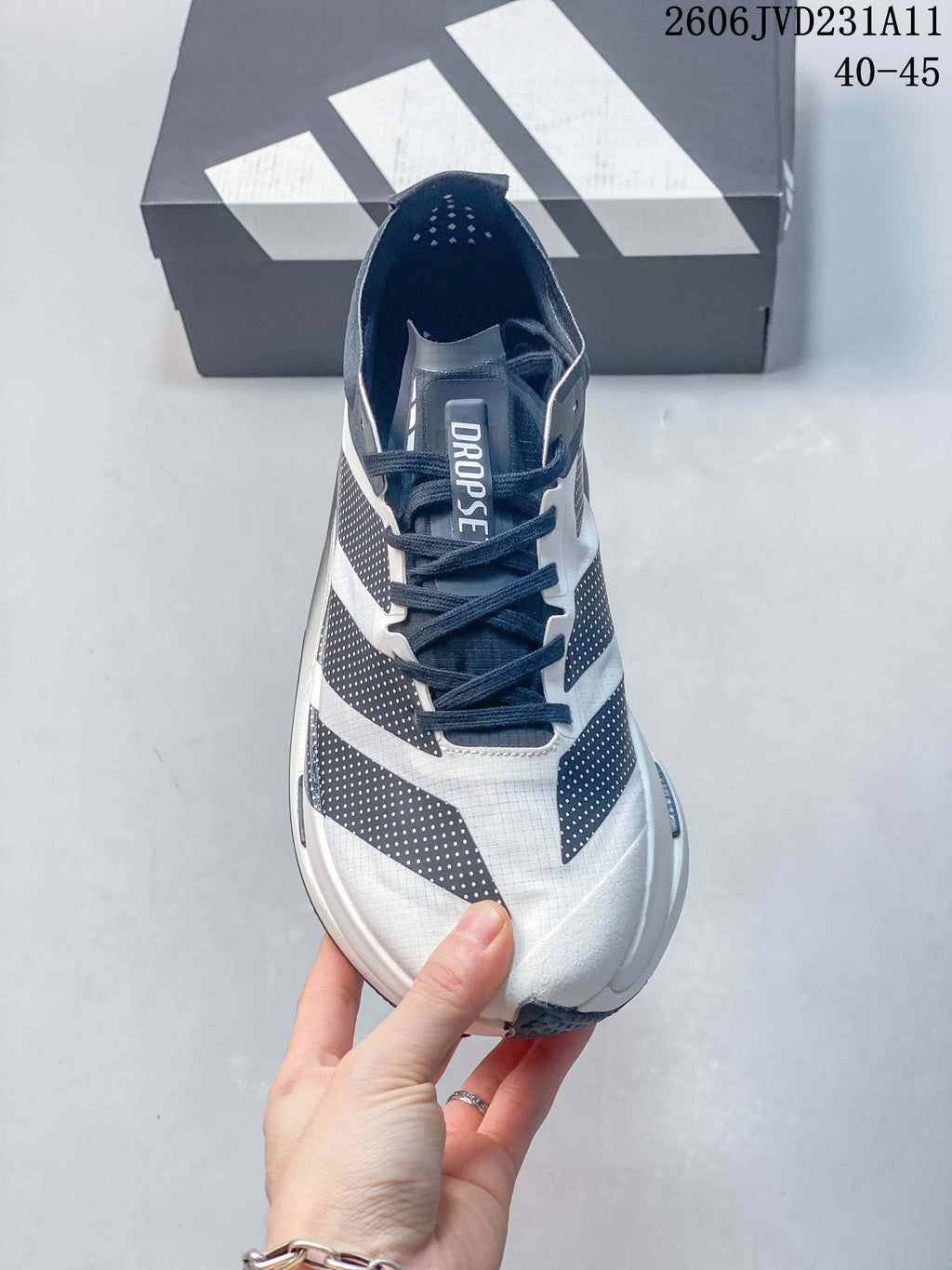 Top view of an Adidas Adizero Dropset Elite shoe with dark laces and a DROPSET tongue label