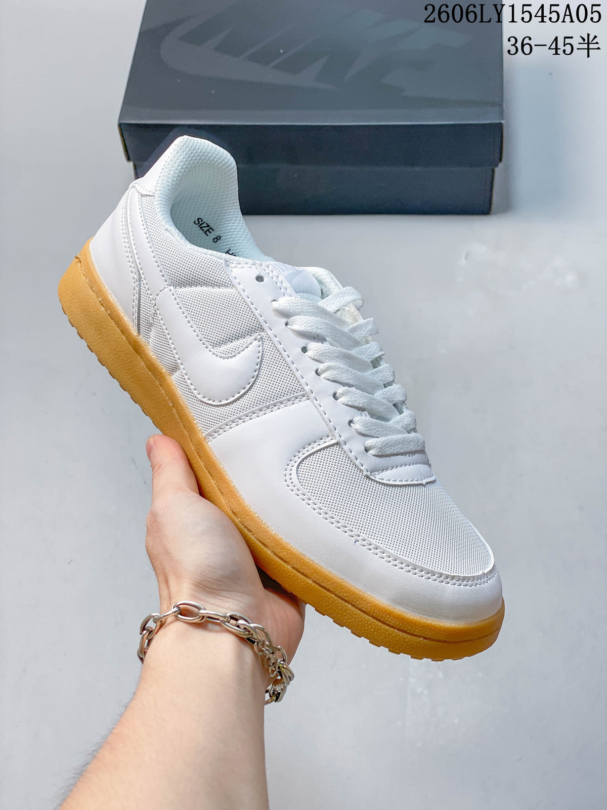Side view of a white Nike Field General low-top sneaker with a gum-colored outsole.