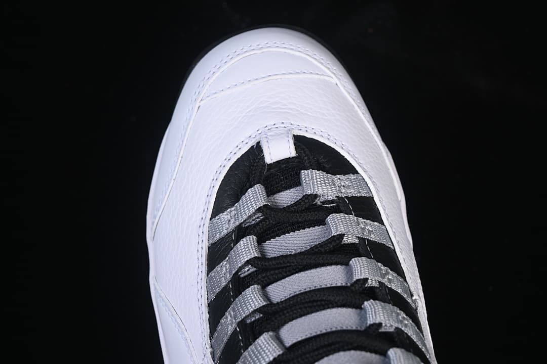 Top view of the white toe and black-and-grey lacing