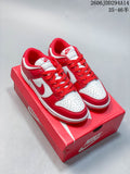 Pair of red and white Nike Dunk Low sneakers shown on a red box.