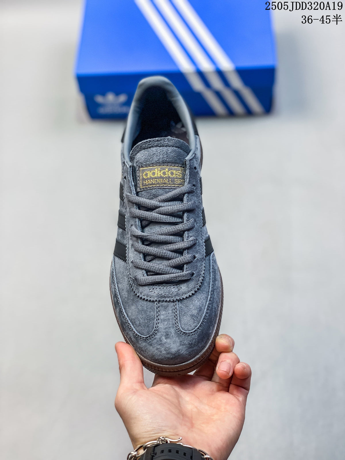 Top view of the grey lace-up sneaker showing its tongue label and rounded toe.