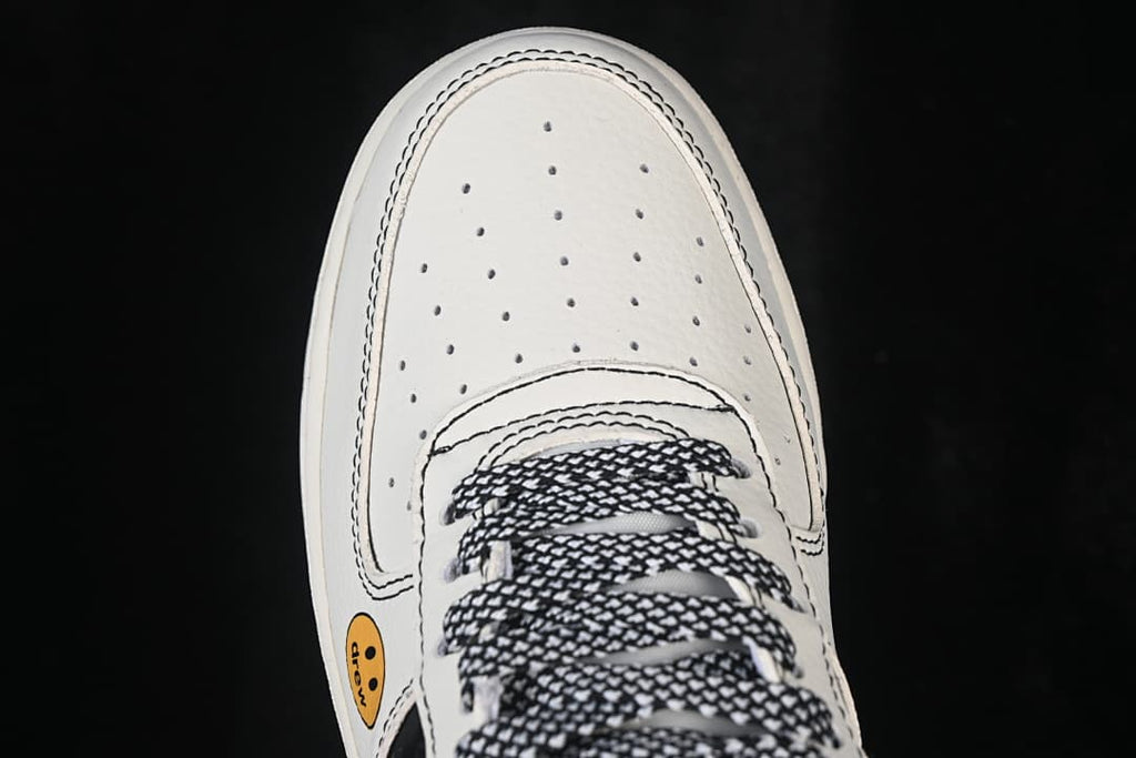 Top-down close-up of the perforated toe and patterned laces