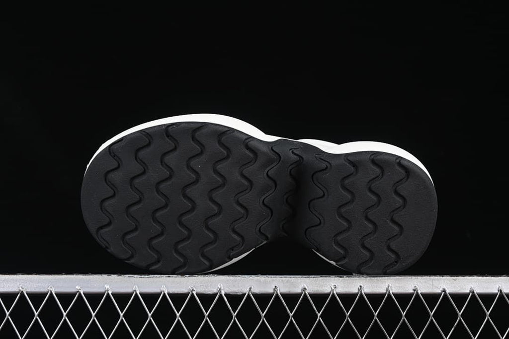 Underside view showing the black wavy-pattern outsole