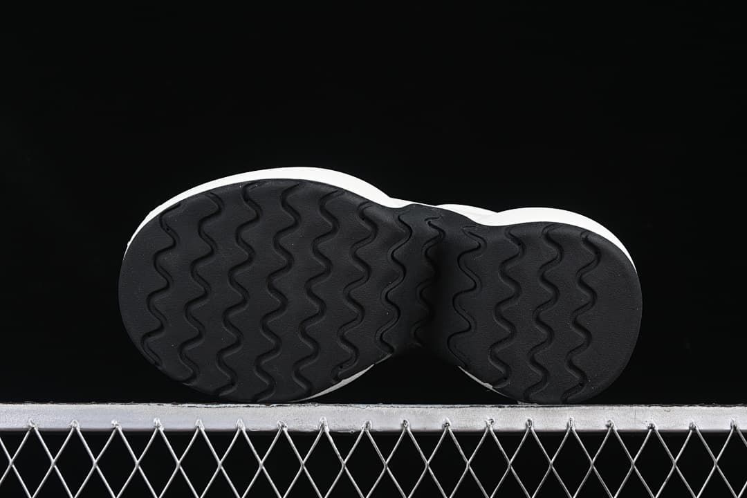 Underside view showing the black wavy-pattern outsole