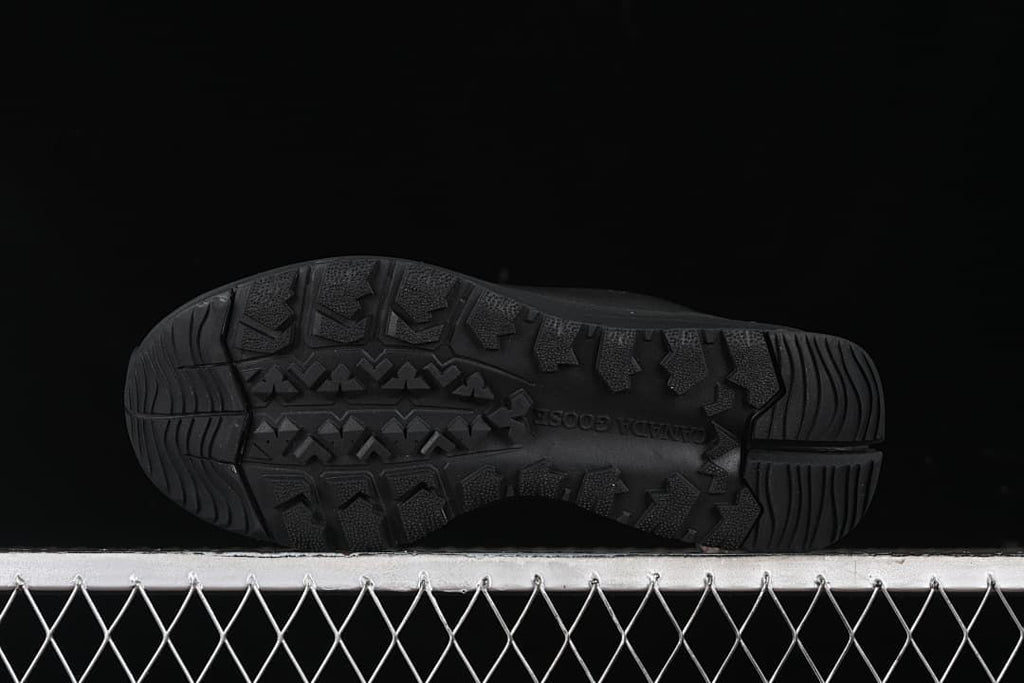 Underside of the sneaker showing its patterned black outsole