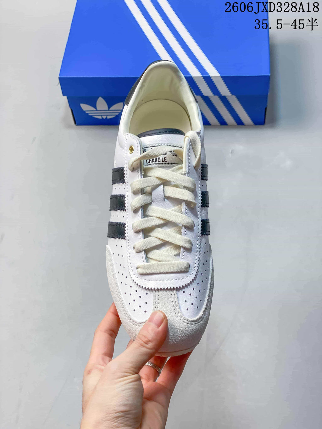 Top view showing the laces, perforated toe panels, and dark stripes