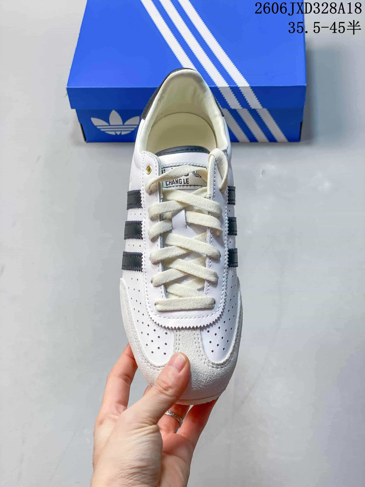 Top view showing the laces, perforated toe panels, and dark stripes