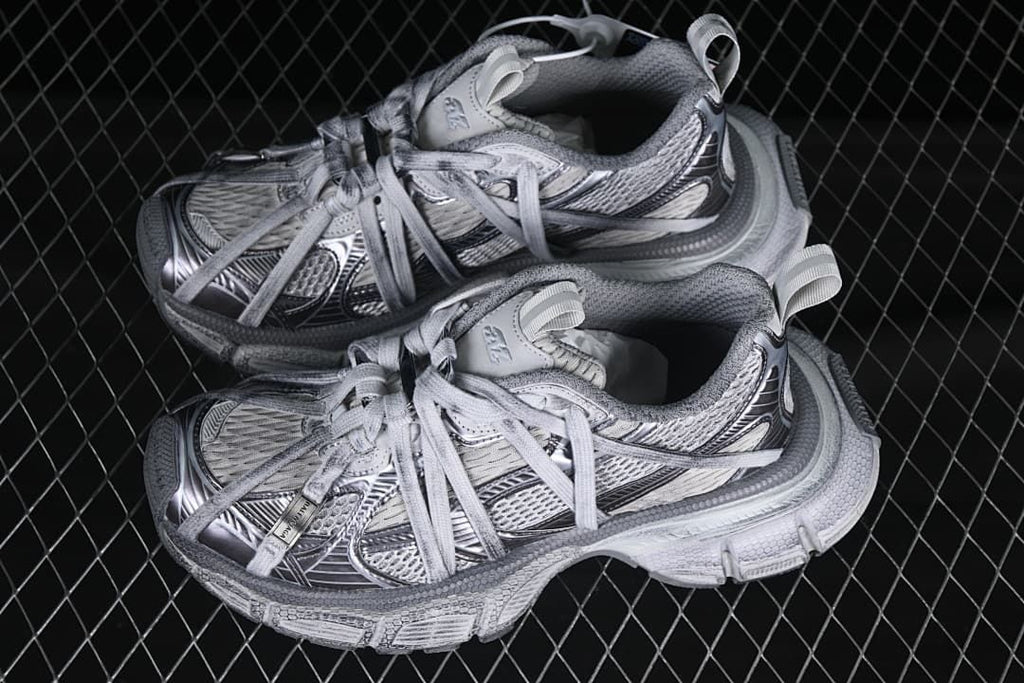 Pair of grey mix sneakers displayed together