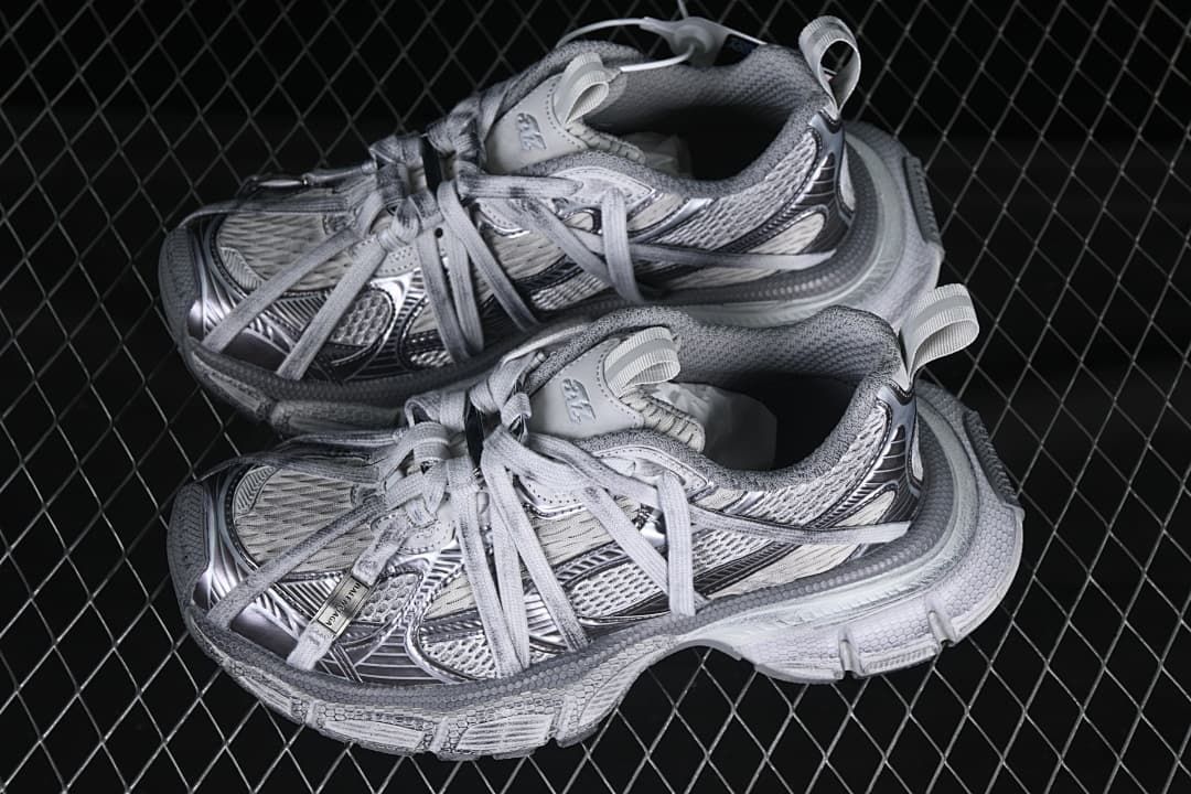 Pair of grey mix sneakers displayed together