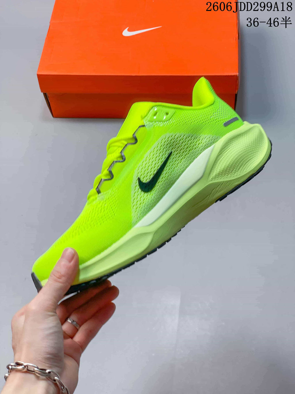 Side view of the volt running shoe with dark Swoosh accents