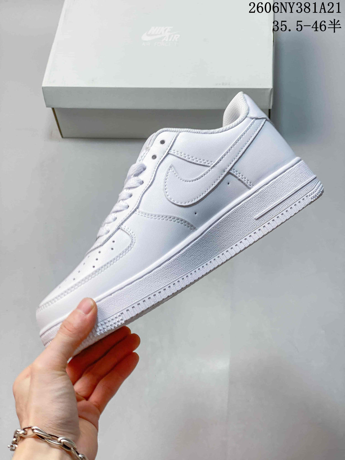 Side profile of a white low-top sneaker with a Swoosh panel