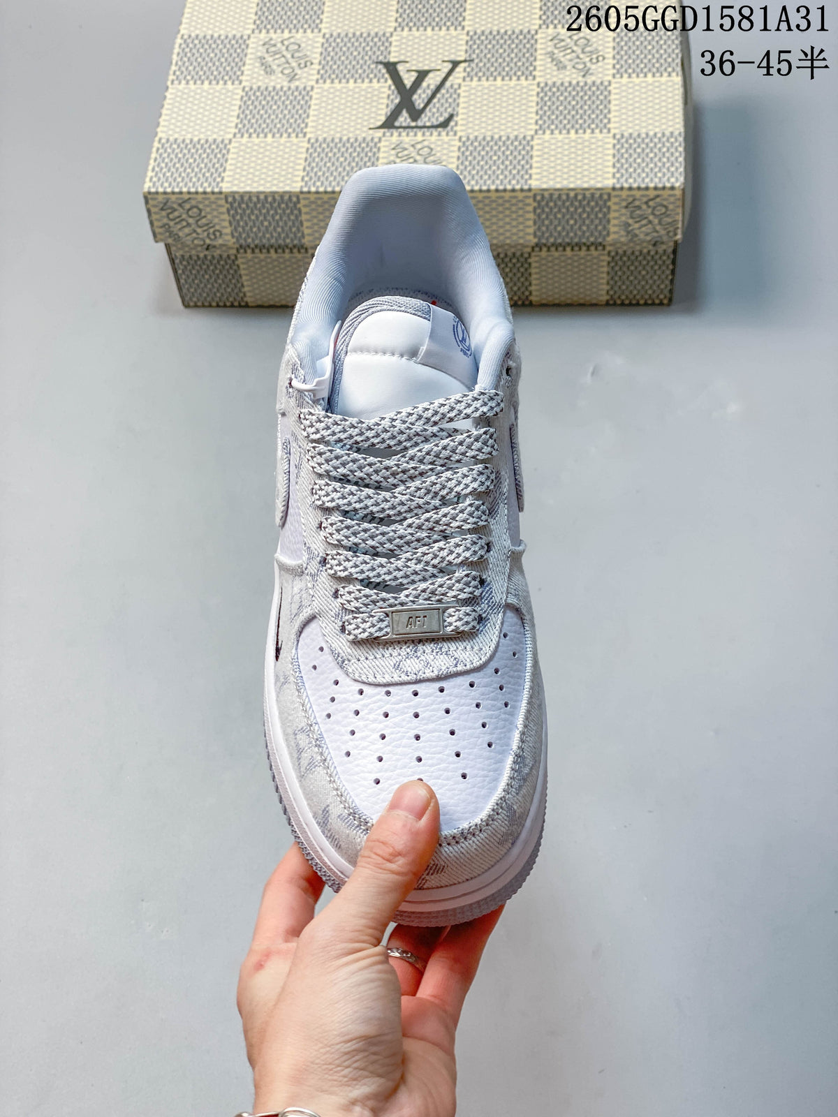 Top view showing the perforated toe and patterned laces of a white sneaker