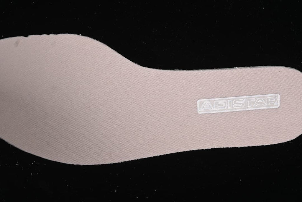Pink-toned insole marked Adistar