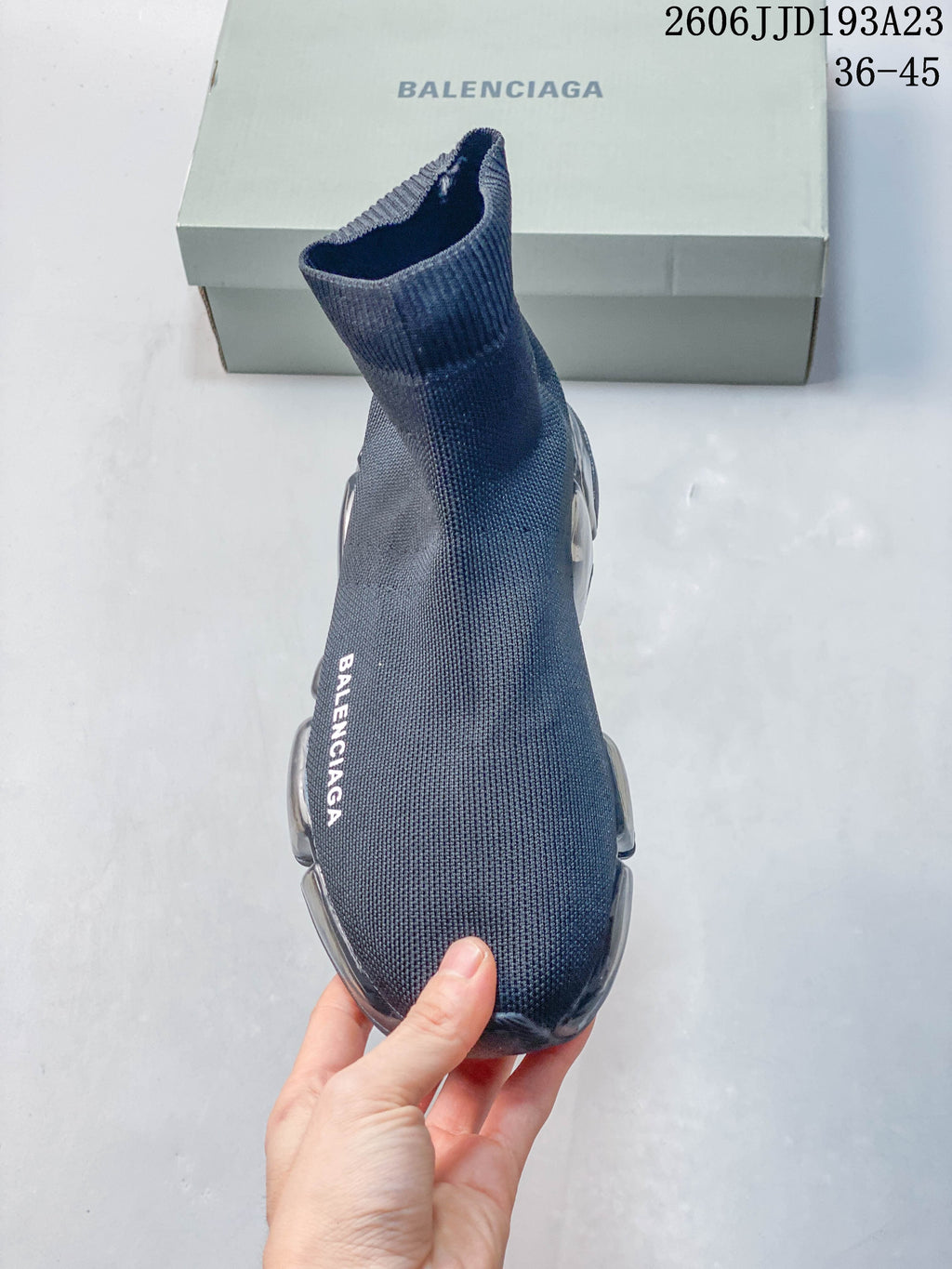 Top view of a gray sock sneaker with white Balenciaga lettering