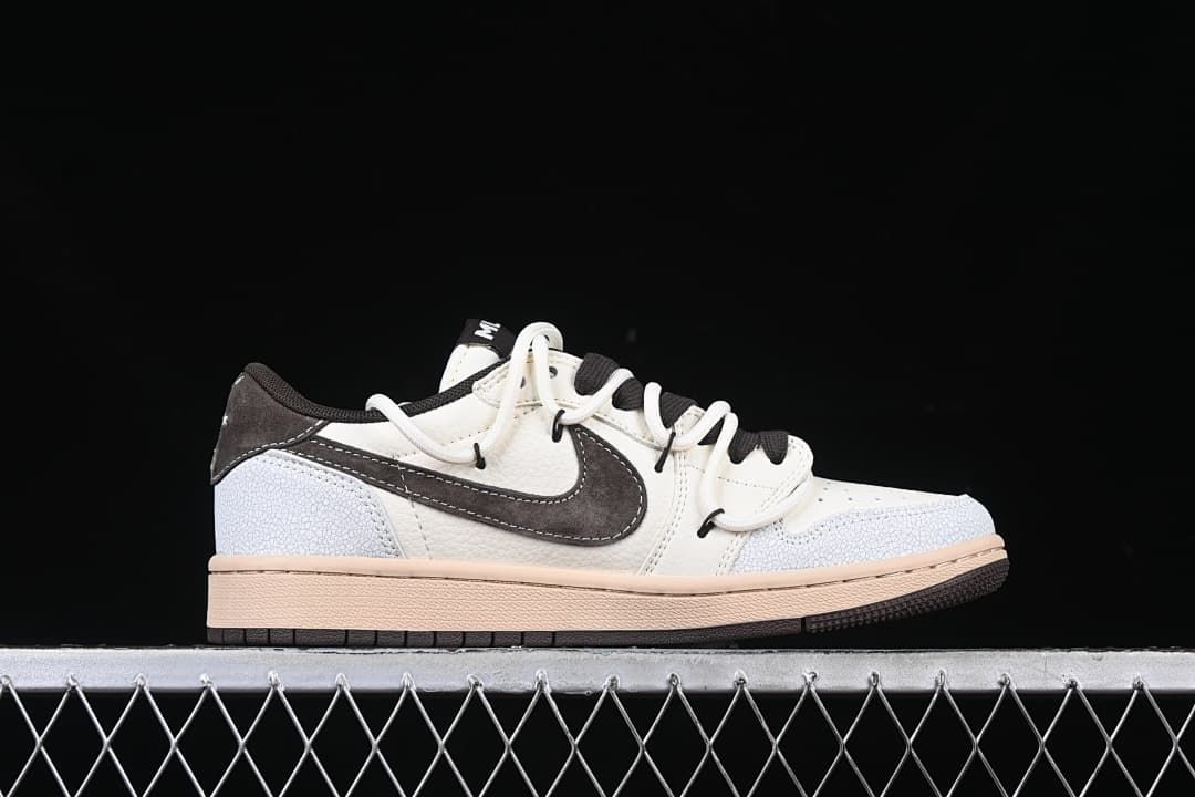 Side profile of the low-top sneaker in off-white, dark brown, pale blue, and tan
