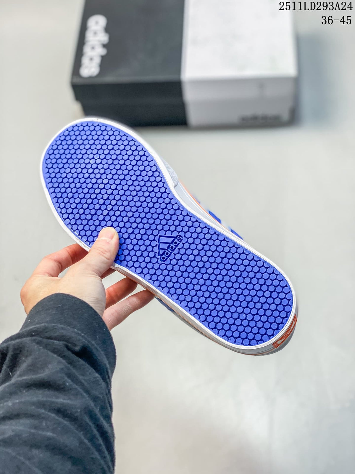 Blue patterned outsole of a gray Adidas sneaker
