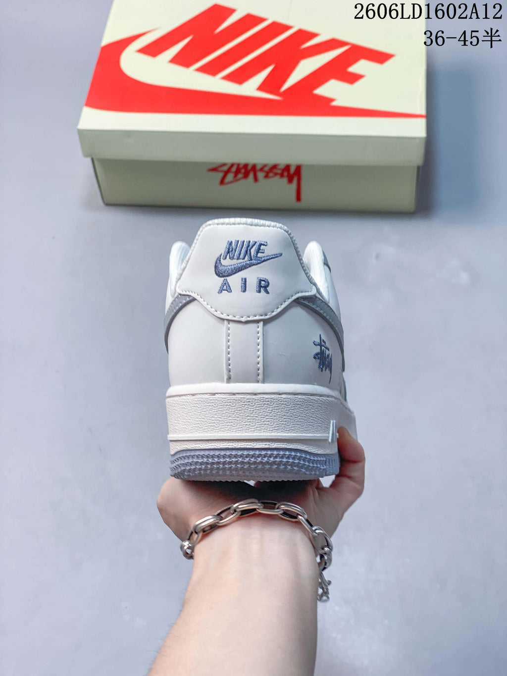 Rear view of an off-white and grey low-top sneaker