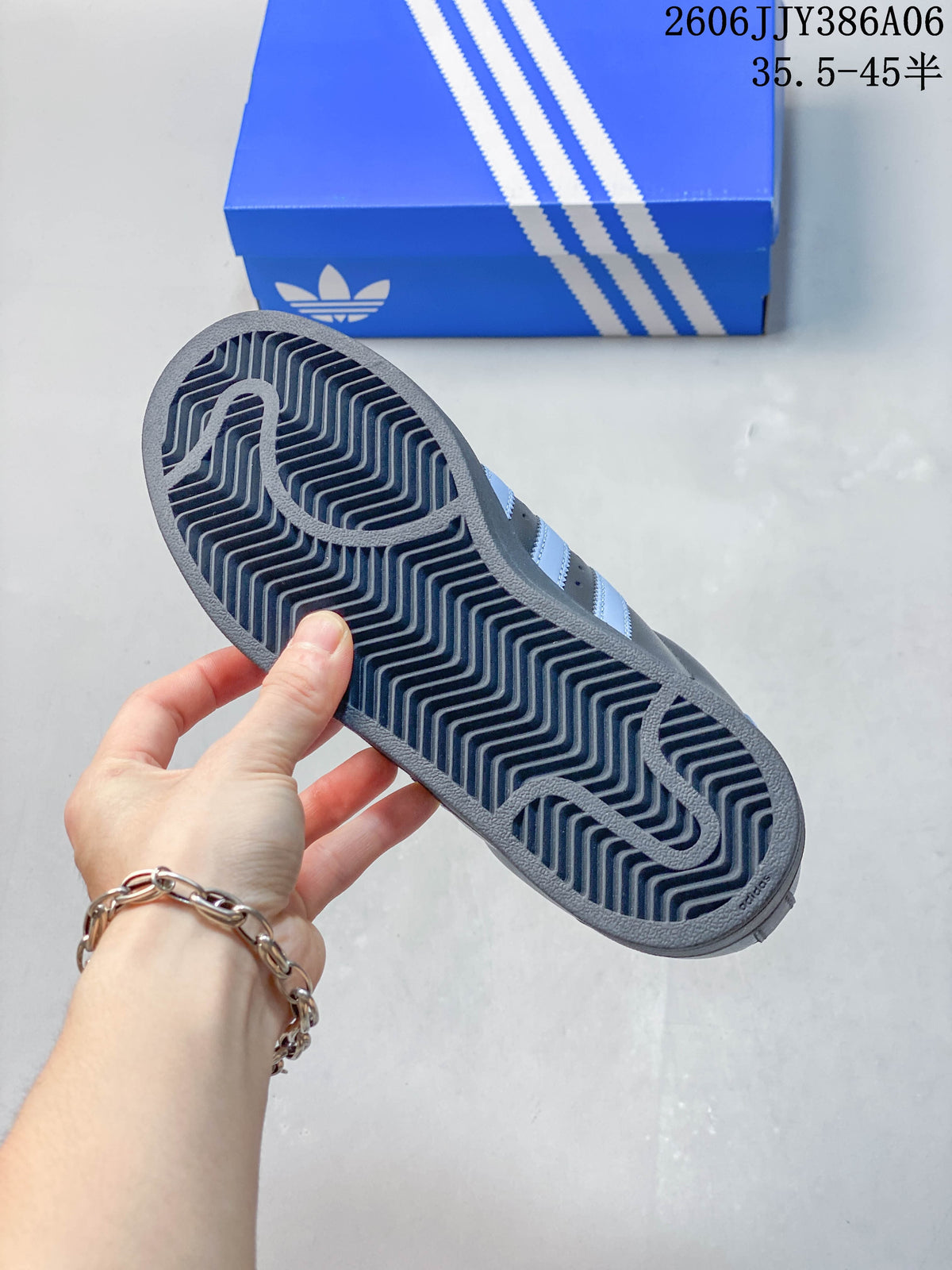 View of the textured outsole on a charcoal adidas Superstar 2 sneaker