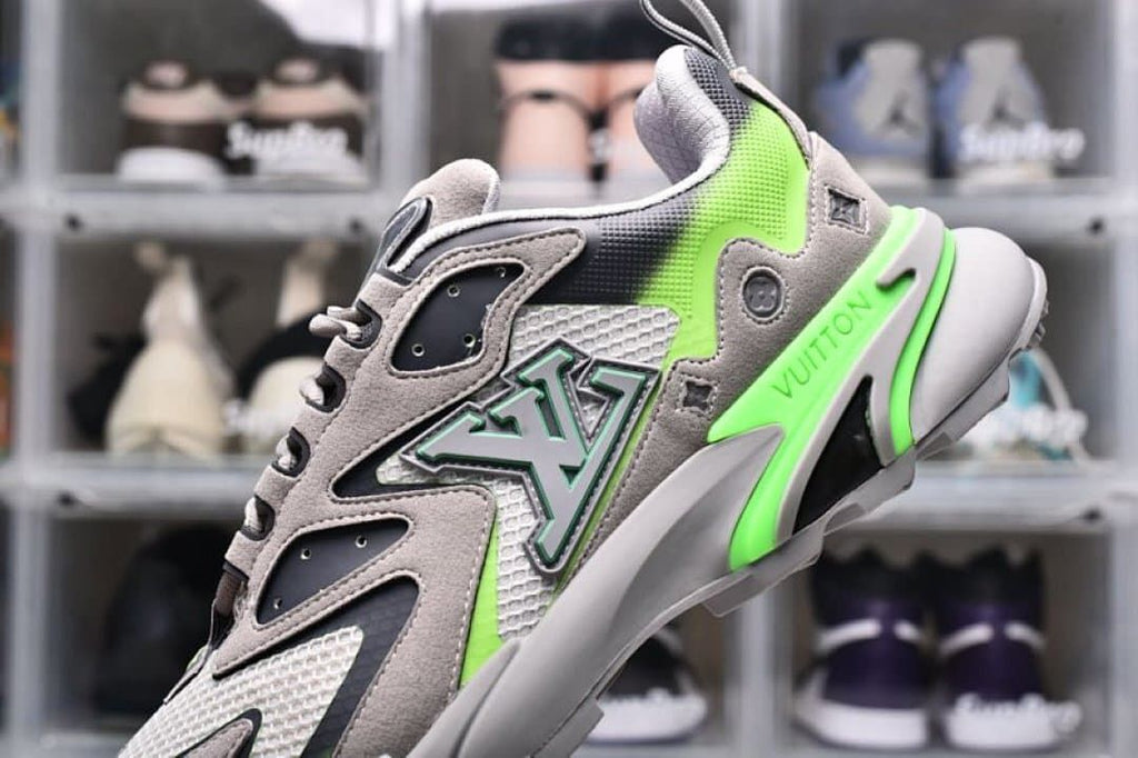 Close-up of the sneaker side emblem and gray-green detailing