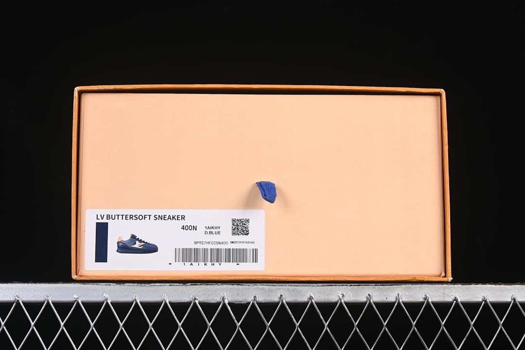 Sneaker box label identifying the style as an LV Buttersoft sneaker in dark blue