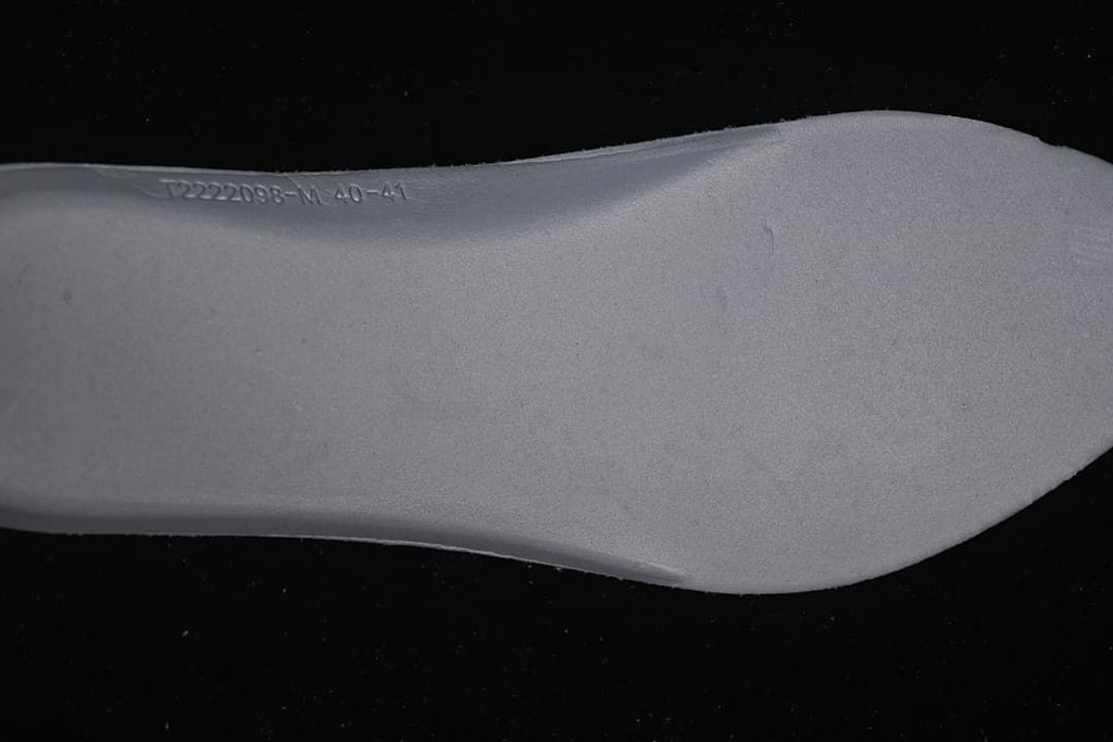 Close-up of the insole with embossed product and size markings.