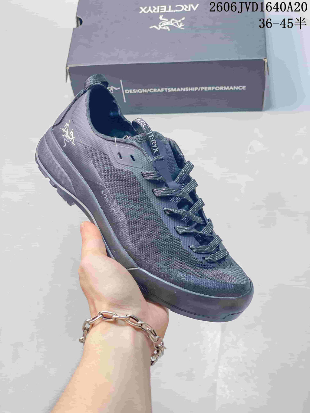 Dark gray Arc'teryx Konseal LT trail shoe with matching laces.
