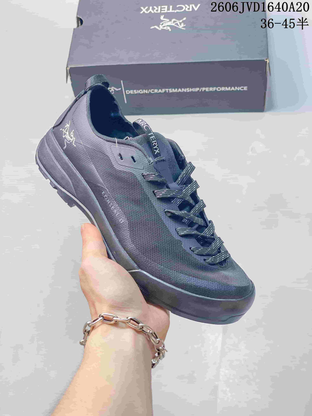 Dark gray Arc'teryx Konseal LT trail shoe with matching laces.